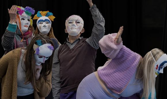 Drama Therapy students performing in masks