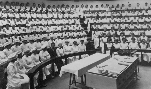 B+W photo of a lecture theatre full of student cooks