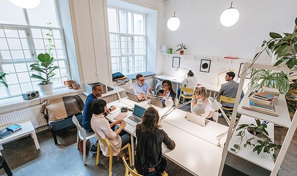 Group of creative people working together in a modern office